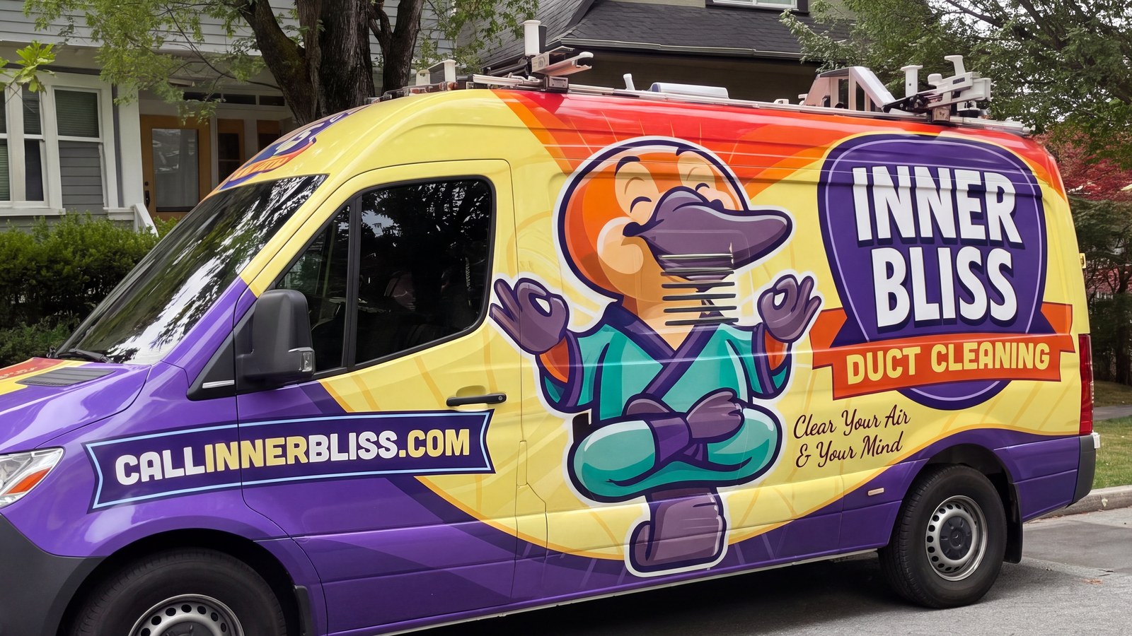 Inner Bliss service van on a residential street